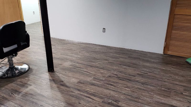 Newly installed wood-look vinyl plank flooring
